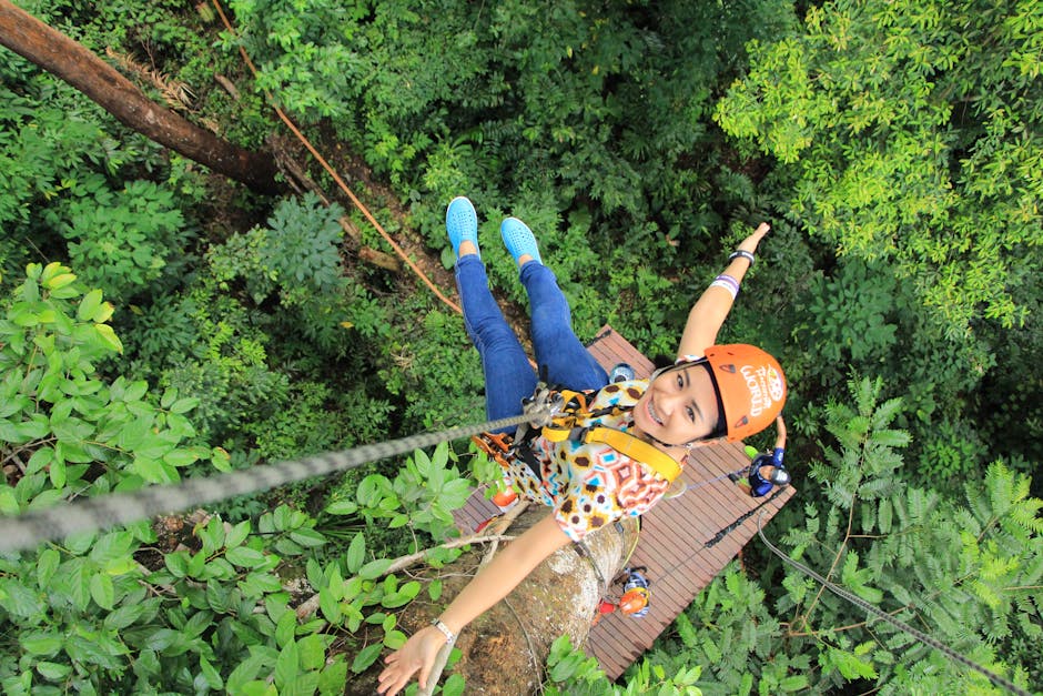 pexels-photo-2041759-2041759 Woman enjoying a thrilling zipline experience in Phuket, Thailand's vibrant green forest.